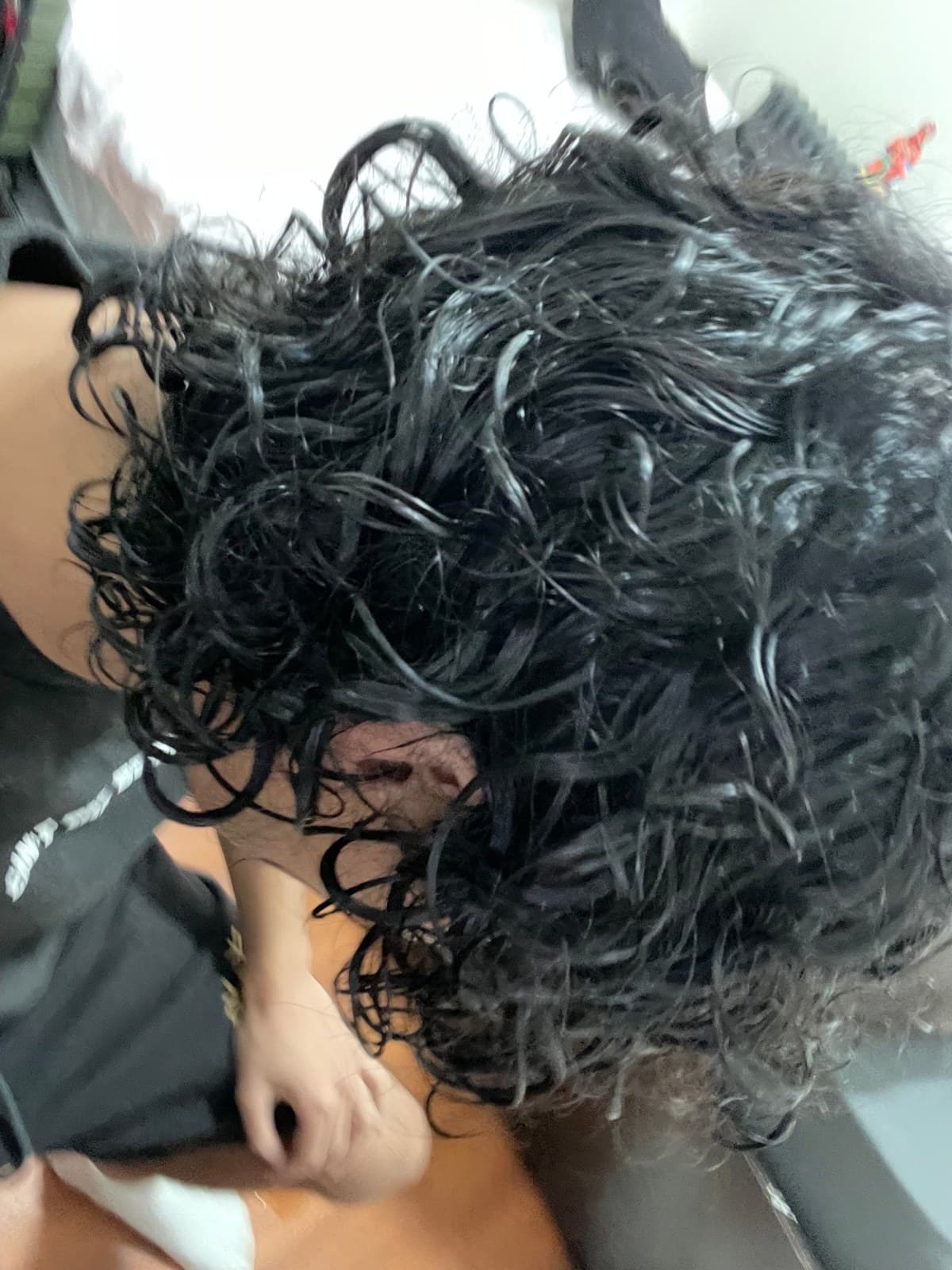Side view of wet curly hair after rinsing